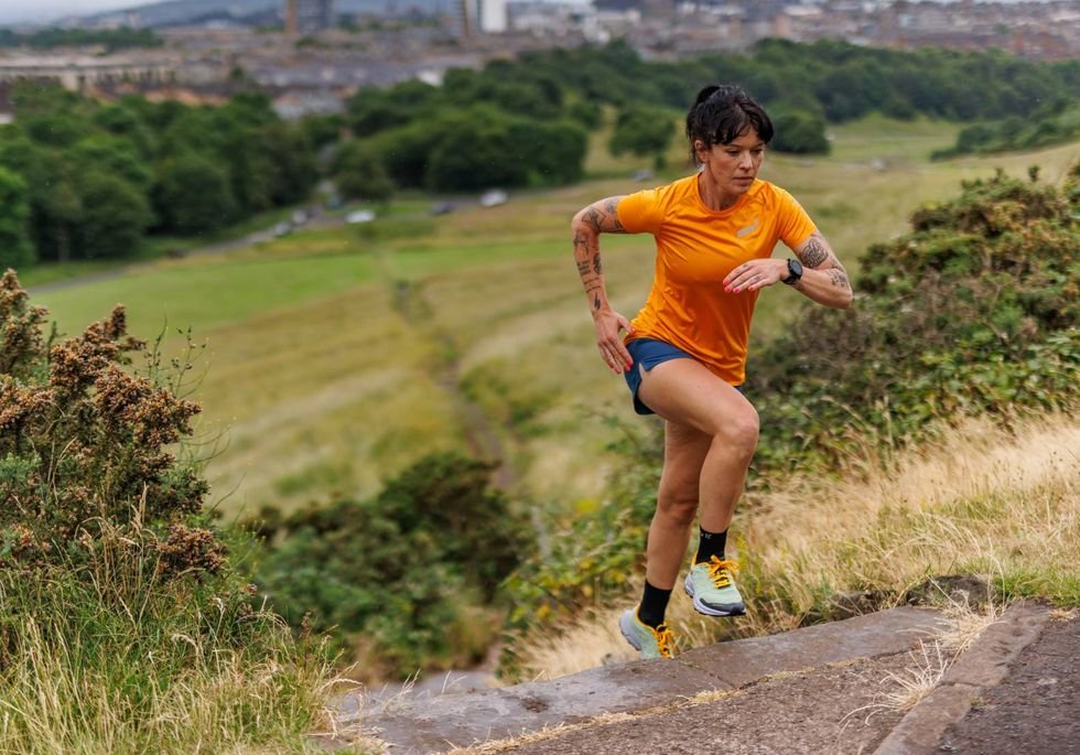 a woman runs on the road